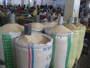 bags of rice being sold by the cup